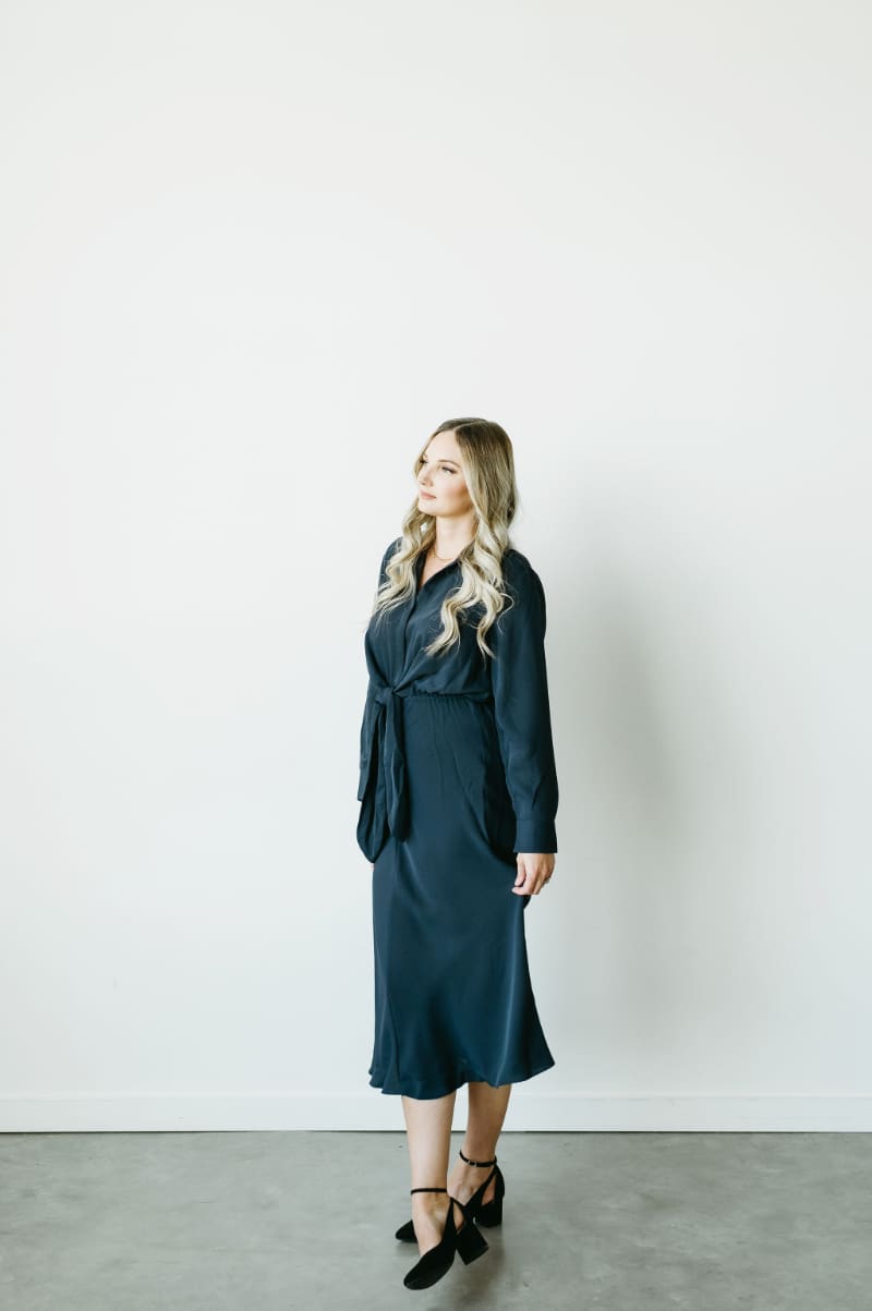HoneyBook Pro Karly Whitaker standing in a bright studio while sharing tips for better HoneyBook pipelines